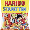 Four packs of Haribo TROPIFRUTTI gummy candy, featuring a vibrant assortment of tropical fruit flavors like pineapple, passion fruit, and mango, imported from Germany