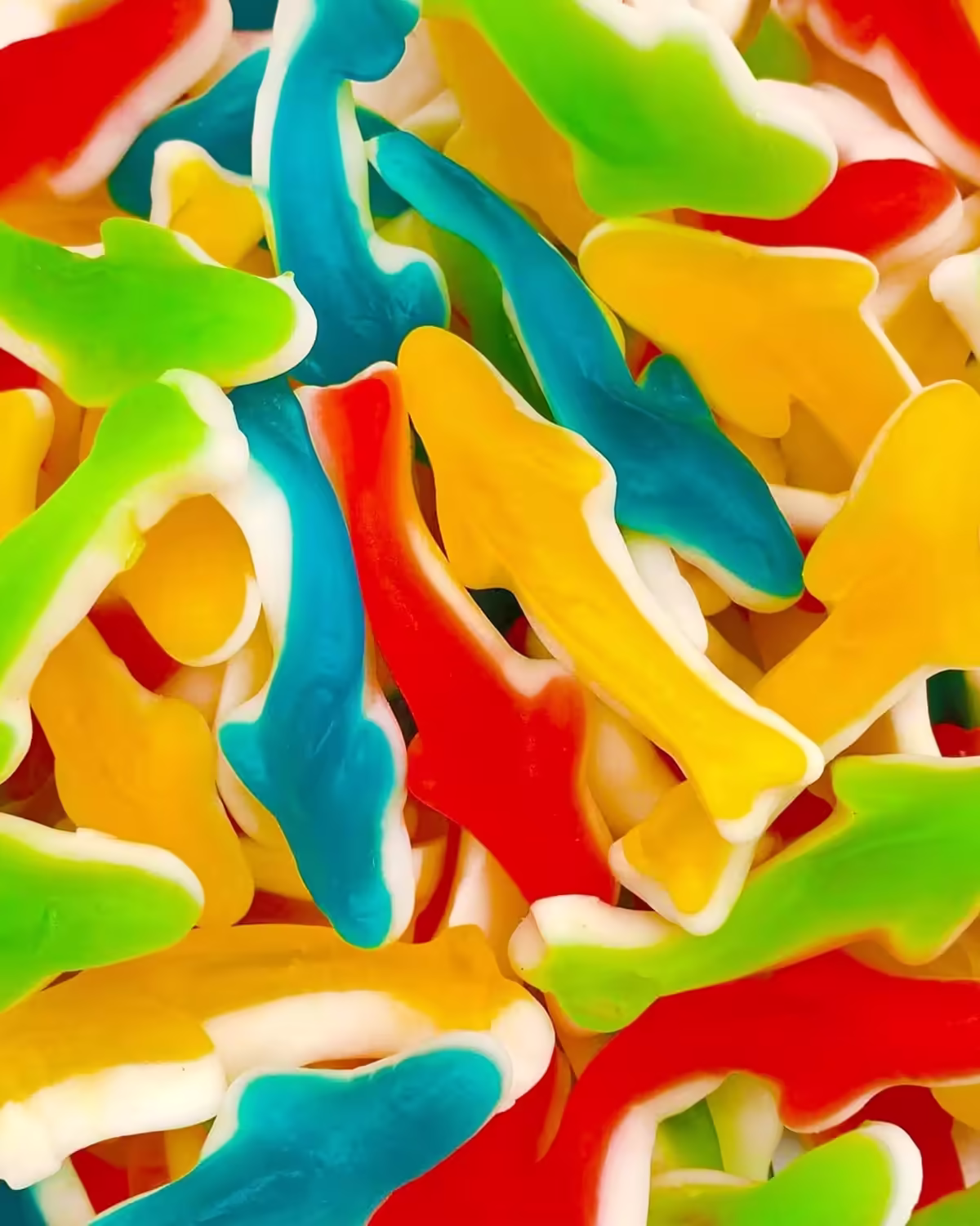 A 1-pound bag of Laeta Foods Gummy Sharks Candy, featuring colorful gummy sharks with mixed fruit flavors of cherry, orange, apple, and blue raspberry, with a white marshmallow-flavored bottom.