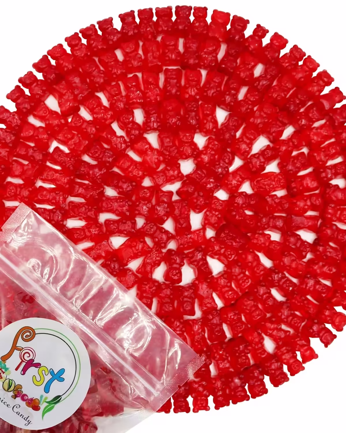 Bright red watermelon-flavored gummy bears formed in a large circle with FirstChoiceCandy bag in left corner on a white background