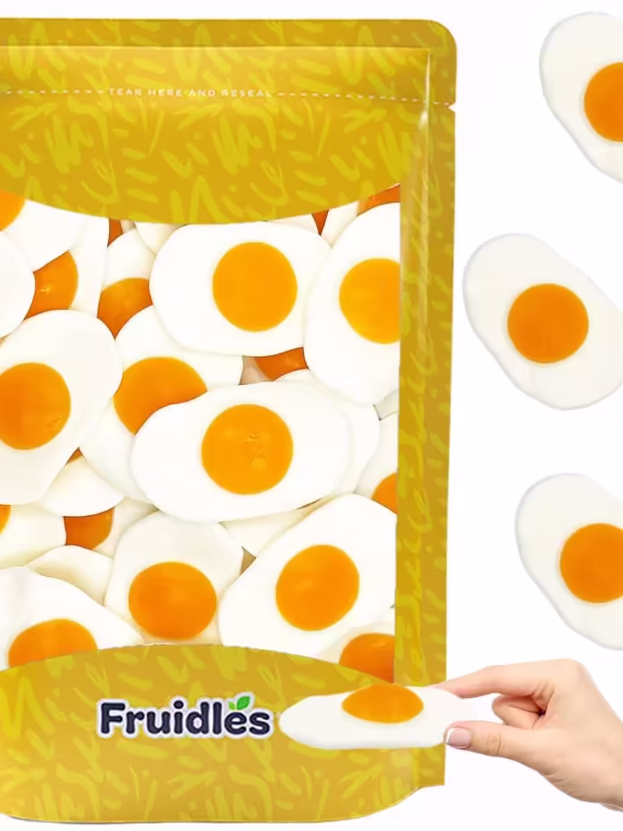A pack of Fruidles Large Fried Egg Gummi Omelet Candy featuring colorful, sunny-side-up egg-shaped gummies with a cheerful fruit flavor, perfect for parties, events, or a fun treat