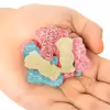 A handful of bright red, pink blue and yellow Sour Patch Kids Lemonade Fest gummies in four flavors: Strawberry Lemonade, Blue Raspberry Lemonade, Cherry Lime Lemonade, and classic Lemonade.